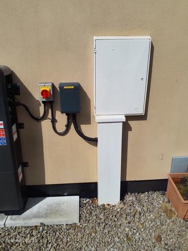 New external meter cabinet, AC isolator and battery distribution board alongside the battery system